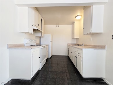 Kitchen featuring light countertops, visible vents