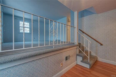 Large, open formal living room with lots of natura
