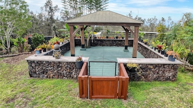 Enjoy pau hana moments or talk story with ‘ohana in this peaceful gazebo, surrounded by lush Hawaiian plants and rock walls. A perfect spot for relaxing, gathering, or just soaking in the aloha vibes.