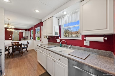 Bright kitchen with Corian Countertops and Vinyl flooring