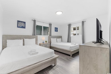 Bedroom with wood finished floors