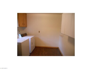 First Floor Laundry Room with New Laminate Floorin