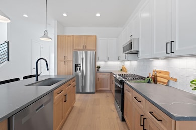 Kitchen with a sink, appliances with stainless st