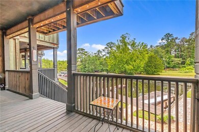 Wooden terrace featuring view of scattered trees