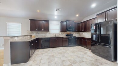 Kitchen offers a breakfast bar, tons of countertop