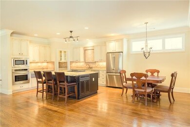 Designed with hosting in mind, this practically new kitchen features 2 Fisher & Paykel dishwashers, Jenn-Air gas stove with grill and downdraft and new oversized island.  