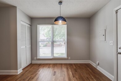 The dining area located off of the kitchen looks out over the front yard.