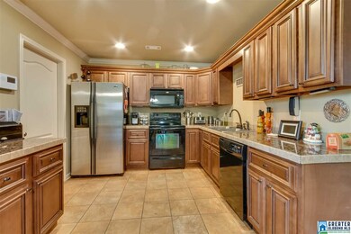 Upgraded cabinets, counters and appliances in this