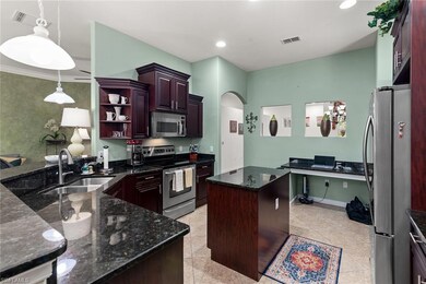 Kitchen featuring visible vents, arched walkways, 