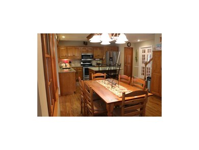 Eat in kitchen with granite counter tops and stain