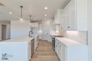 Kitchen with appliances with stainless steel finis