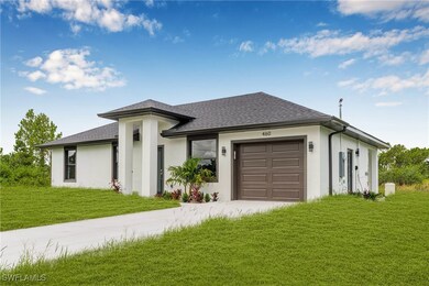 Prairie-style home featuring a garage, roof with s