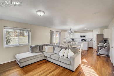 Open to the kitchen and dining room, this space is