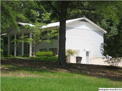 Side view of home and basement garage.
