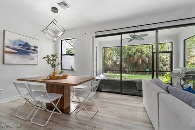 Dining space with ceiling fan and light hardwood /