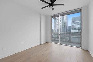 Empty room with expansive windows, wood finished 