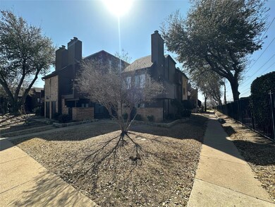 View of home's exterior featuring a chimney, fence