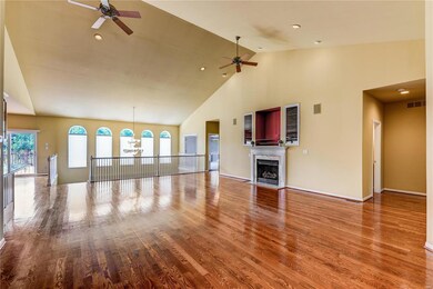 Great room with soaring vaulted ceilings and gas f