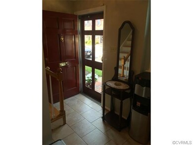 ENTRY FOYER WITH CERAMIC FLOORING.