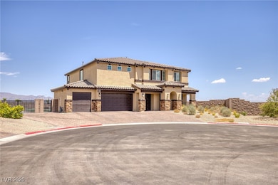 Mediterranean / spanish-style home with stucco siding, stone siding, decorative driveway, a tile roof, and an attached garage