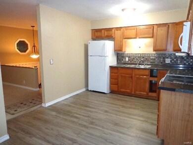 Another view of the kitchen leading into the livin