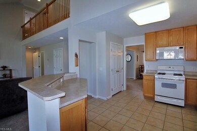 Kitchen with Ceramic Tile Floor is Open to Dining 