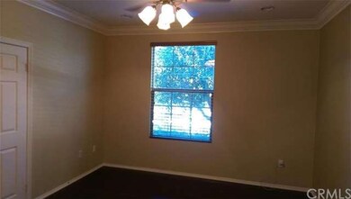 Master bedroom with crown molding, ceiling fan and
