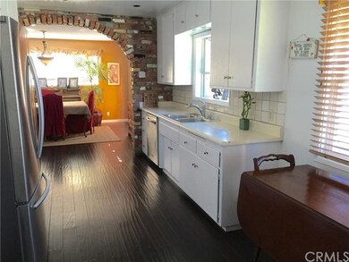Kitchen view of eating area and opening to family 
