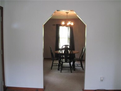 Pretty archway leads from the living room to the d