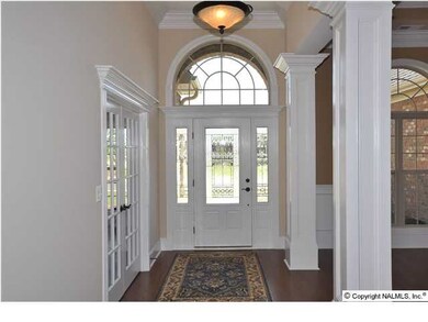 IMMEDIATELY UPON ENTRY YOU WILL BE INSPIRED BY THE DETAILED MOULDINGS AND DESIGNED TOUCHES FOUND THROUGHOUT THIS HOME