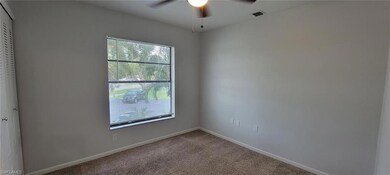Unfurnished room with a ceiling fan, carpet flooring, and baseboards