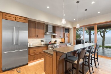 Kitchen featuring wall chimney exhaust hood, Coria