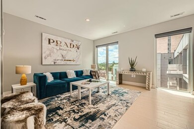 Enjoy the lush living room with floor-to-ceiling v