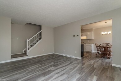 Freshly painted living room with wide plank vinyl 