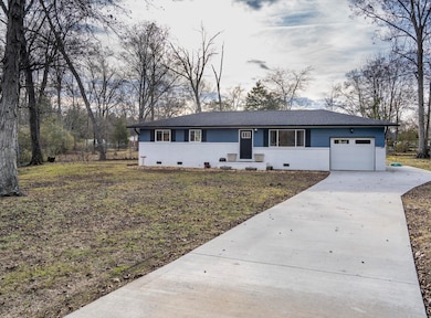 house front with parking pad
