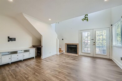 Unfurnished living room featuring hardwood / wood-