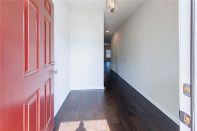 Entrance foyer featuring dark wood finished floors and recessed lighting