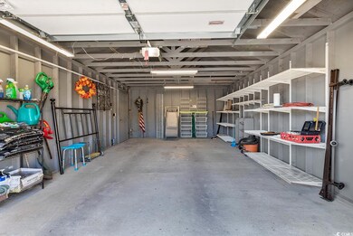 Garage featuring a garage door opener