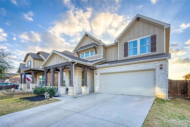 Craftsman inspired home with concrete driveway, a