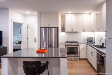 Kitchen with stainless steel appliances, a sink, 