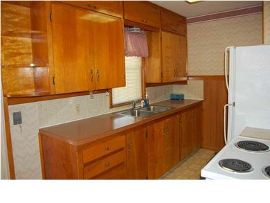Kitchen with cabinets to the ceiling