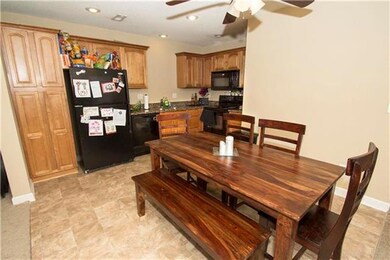 The kitchen highlights granite counters and abunda