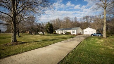 Long concrete driveway with turnaround with a perf