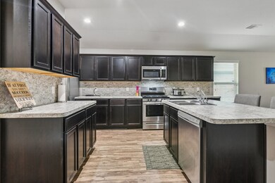The space is well-lit with recessed lighting and h