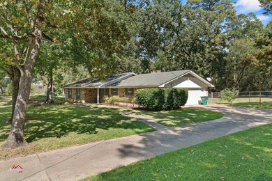 Single story home with a front lawn and a garage