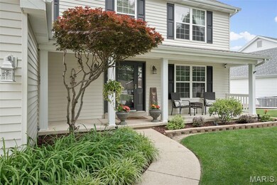 View of exterior entry featuring covered porch
