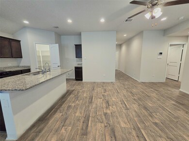 Spacious open-concept living room and kitchen, per
