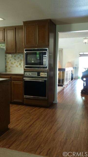 HARDWOOD EXTENDS INTO THE KITCHEN
