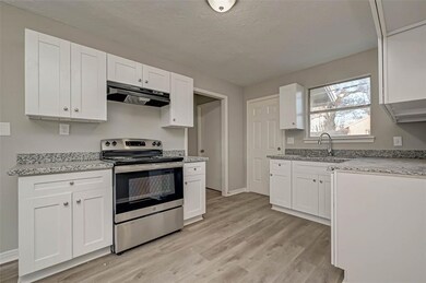 White Cabinets open kitchen with breakfast room