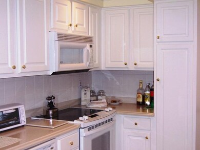 Kitchen. Lovely white kitchen with corian counters
